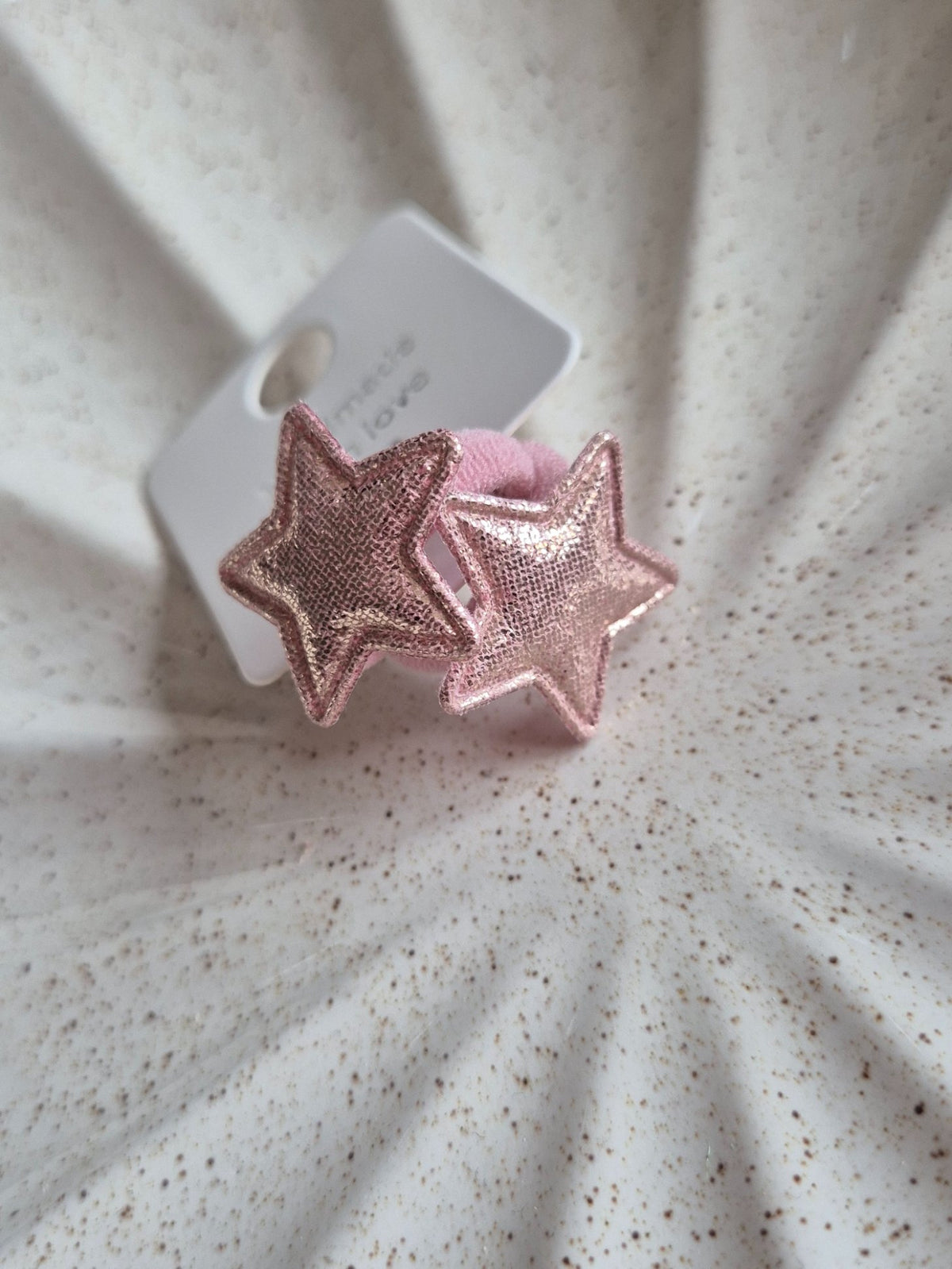 6973ca546c51700180f9ca2f_glitter-ster-elastiek-roze_1793189571851.jpg